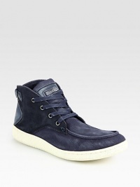 A remarkably cool lace-up with urban appeal designed in slightly-distressed canvas and suede.Canvas/suede upperPadded insoleRubber soleImported A remarkably cool lace-up with urban appeal designed in slightly-distressed canvas and suede.Canvas/suede upperPadded insoleRubber soleImported