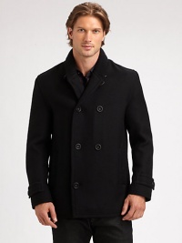 A modern fit, double-breasted peacoat is tailored from superior wool featuring a plaid lining and a ribbed-knit collar for a timeless design that will last throughout this cold-weather season and beyond.Button-frontRibbed-knit collarFully linedAbout 32 from shoulder to hemWoolDry cleanImported