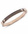 Rosy style that begs to be stacked. This hinge bracelet by Michael Kors embellishes a classic bangle with pave-set glass accents. Crafted in rose-gold tone mixed metal. Approximate diameter: 2-1/4 inches.