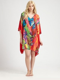 Vivid colors swirl on this flowing animal-inspired design of silky-smooth material. V-neckThree-quarter length dolman sleevesAbout 36 from shoulder to hemPolyesterMachine washImported Vivid colors swirl on this flowing animal-inspired design of silky-smooth material. V-neckThree-quarter length dolman sleevesAbout 36 from shoulder to hemPolyesterMachine washImported