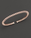 Dazzling diamonds, set in 14K pink gold, make the perfect bracelet for stacking.