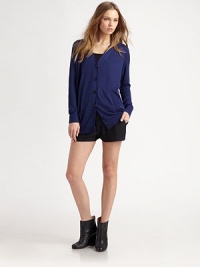 The classic V-neck in a stylish, oversized knit.V necklineRaglan sleevesButton-down placketRibbed trimAbout 33 from shoulder to hemViscoseDry cleanImportedModel shown is 5'11 (180cm) wearing US size Small. The classic V-neck in a stylish, oversized knit.V necklineRaglan sleevesButton-down placketRibbed trimAbout 33 from shoulder to hemViscoseDry cleanImportedModel shown is 5'11 (180cm) wearing US size Small.