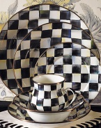 A charming way to add color and personality to the dinner table, crafted in a checkerboard juxtaposition of ivory and onyx with bronzed stainless steel trim. Enameled steel 12 diam. Dishwasher safe Made in USA 