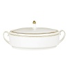 Rings of gold adorn fine white bone china with the lustrous shine of a wedding band. White bone china features two different border trims of gold, a wide corded border of textured grosgrain ribbon on some pieces, a narrow edge on others.