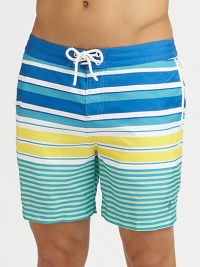 A quick-dry look with a colorful melange of printed stripes revive a classic beach style. Drawstring waistBack flap pocketsMesh liningInseam, about 6PolyesterMachine washImported A quick-dry look with a colorful melange of printed stripes revive a classic beach style. Drawstring waistBack flap pocketsMesh liningInseam, about 6PolyesterMachine washImported