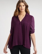 An airy top with raw-edge details that offers a relaxed, boxy fit.V-neckTab sleevesOne front pocketAbout 30 from shoulder to hemRayonHand washMade in USA