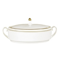 Rings of gold adorn fine white bone china with the lustrous shine of a wedding band. White bone china features two different border trims of gold, a wide corded border of textured grosgrain ribbon on some pieces, a narrow edge on others. Rings of gold adorn fine white bone china with the lustrous shine of a wedding band. White bone china features two different border trims of gold, a wide corded border of textured grosgrain ribbon on some pieces, a narrow edge on others.