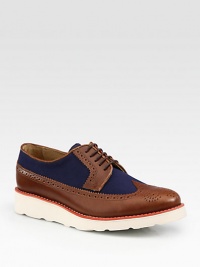 Effortless style and sensibility is achieved with this uniquely crafted oxford design with perforated detail, finished in leather and canvas.Leather/Canvas upperPadded insoleRubber soleImported Effortless style and sensibility is achieved with this uniquely crafted oxford design with perforated detail, finished in leather and canvas.Leather/Canvas upperPadded insoleRubber soleImported