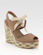 Braided hemp wedge and platform in a two-tone design, topped with a soft canvas upper and lace-up front. Braided hemp wedge, 5 (125mm)Braided hemp platform, 1 (25mm)Compares to a 4 heel (100mm)Canvas upperCanvas liningRubber solePadded insoleImportedOUR FIT MODEL RECOMMENDS ordering true whole size; ½ sizes should order the next whole size up. 