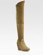 Thigh-high suede wedge design with an exposed back zipper and contoured shaft. Stacked wedge, 4 (100mm)Covered platform, ½(15mm)Compares to a 3½ heel (90mm)Shaft, 24Leg circumference, 15Suede upperBack zipperShearling liningRubber solePadded insoleMade in Italy