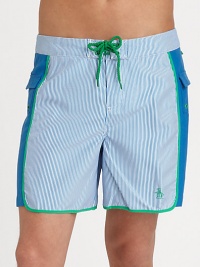 A quick-dry look with printed mini-stripes revive a classic beach style. Drawstring waistBack flap pocketsMesh liningInseam, about 6PolyesterMachine washImported 