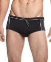 Get comfortable. Consistently look and feel at your best in these classic brief swim trunks from Calvin Klein.