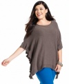 Stay chic and warm in Alfani's plus size poncho, beautifully accented by ruffled edges.