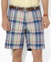 A versatile essential for every warm-weather wardrobe, a soft cotton chino short features one solid side and one madras side for a timeless, preppy look.