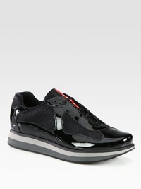 Remarkably stylish lace-up of shiny patent leather with mesh detail finished with a multicolored, striped rubber sole.Leather and mesh upperPadded insoleRubber soleImported Remarkably stylish lace-up of shiny patent leather with mesh detail finished with a multicolored, striped rubber sole.Leather and mesh upperPadded insoleRubber soleImported