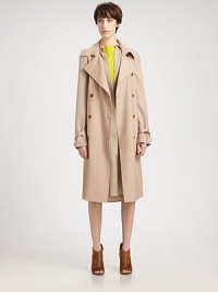 A refined take on the traditional trench, finished with belted cuffs and a matching self belt.Point collarDouble-breasted button frontSelf beltSide slash pocketsBelted cuffsRainflapBack ventFully linedAbout 41 from shoulder to hem98% wool/2% elastaneDry cleanImportedModel shown is 5'10 (177cm) wearing US size 4. A refined take on the traditional trench, finished with belted cuffs and a matching self belt.Point collarDouble-breasted button frontSelf beltSide slash pocketsBelted cuffsRainflapBack ventFully linedAbout 41 from shoulder to hem98% wool/2% elastaneDry cleanImportedModel shown is 5'10 (177cm) wearing US size 4.