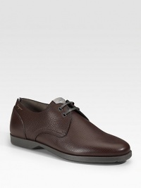 A two-eyelet derby style designed in pebbled calfskin leather. Leather lining Padded insole Rubber sole Made in Italy A two-eyelet derby style designed in pebbled calfskin leather. Leather lining Padded insole Rubber sole Made in Italy