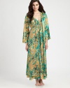 Experience the luxury of silky-smooth fabric featuring an artistic floral print. V-neckLong bell sleevesSelf-tie waistBack cinched waistbandAbout 53 from shoulder to hemPolyesterMachine washImported