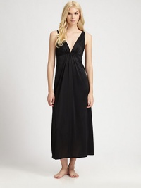 With a goddess-like appeal, this silky knit feels as divine as it looks. Deep plunging V neckline Pleated bodice Empire waist with pleating Deep V back About 54 from shoulder to hem PolyesterMachine washImported With a goddess-like appeal, this silky knit feels as divine as it looks. Deep plunging V neckline Pleated bodice Empire waist with pleating Deep V back About 54 from shoulder to hem PolyesterMachine washImported