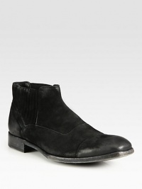 A classic ankle boot style with a remarkably modern edge, rendered in lightly distressed Italian leather and suede.Leather upperSide elastic goresLeather liningLeather soleMade in Italy A classic ankle boot style with a remarkably modern edge, rendered in lightly distressed Italian leather and suede.Leather upperSide elastic goresLeather liningLeather soleMade in Italy
