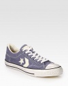 Lace-up canvas basic has a contrasting rubber toecap, sole and artful side details. Padded insoleRubber soleImported