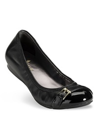 Buckled down elegance in a ballet flat with cap toe detail. From Cole Haan. Buckled down elegance in a ballet flat with cap toe detail. From Cole Haan.