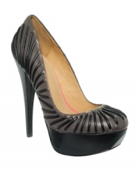 Unique stripes make for a festive and fancy look. L.A.M.B.'s Holiday platform pumps feature leather lines across the vamp and a chunky leather-covered platform and sole. Unique stripes make for a festive and fancy look. L.A.M.B.'s Holiday platform pumps feature leather lines across the vamp and a chunky leather-covered platform and sole.