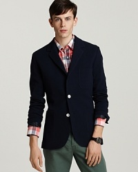 The contrast buttons of this handsome 2-button blazer add whimsy to your refined-and-relaxed look. The contrast buttons of this handsome 2-button blazer add whimsy to your refined-and-relaxed look.