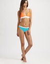 A seductive swim design featuring bust-flattering seams. Plus, colorblocking is right on trend.Halter strap designSeamed cupsBanded hemBack clasp closure at crisscross backFully lined80% polyamide/20% elastaneHand washMade in USA of Italian fabric Please note: Bikini bottom sold separately. 