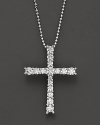 White gold graduated diamond cross pendant with ball chain.