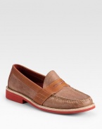 A traditional loafer style is redefined by its contrasts in finely textured leather.Leather upperLeather liningPadded insoleRubber soleImported