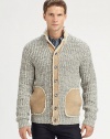 An innovative design that exudes luxury and warmth, knitted from Shetland wool with leather accents along the placket, pockets and elbow patches for a definitive look.Button-frontStand collarWoolDry cleanImported