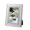 Vera Wang's Blanc Sur Blanc frame features a wide border of vivid silver plate that warmly complements treasured photographs.