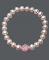 A traditional design receives a sparkling touch. Cultured freshwater pearls (8-9 mm) in shimmery pink hues adorn this chic stretch bracelet, while a pink crystal fireball adds extra glamour. Approximate diameter: 3-1/2 inches.