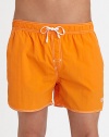 With stitched details and a grip-tape back patch pocket, these stylish swim trunks are both sporty and functional.Elastic drawstring waistStich detail at flySlash side pocketsBack grip-tape patch pocketInseam, about 4½PolyamideMachine washImported