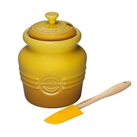 Mustard jar with silicone spreader. Made from the same high quality stoneware as all Le Creuset products its high temperature firing and multilayer glaze doesn't absorb odors or flavors. Mustard jar with silicone spreader. Made from the same high quality stoneware as all Le Creuset products its high temperature firing and multilayer glaze doesn't absorb odors or flavors.