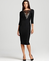 Wavy ribbing lends a textured look to this Mark + James by Badgley Mischka dress. The fitted silhouette exudes subtle sparkle with a sequin-detailed illusion neckline. Wavy ribbing lends a textured look to this Mark + James by Badgley Mischka dress. The fitted silhouette exudes subtle sparkle with a sequin-detailed illusion neckline.