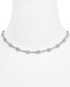 All-around pavé-adorned crystal stations impart elegant allure to this Nadri necklace, refined in rhodium-plated metal.