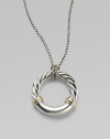 From the Metro Collection. A sleek, sophisticated circle, combining smooth and cabled sterling silver with accents of 18k gold, hangs from a richly textured silver chain and bale. Sterling silver and 18k yellow gold Chain length, about 18 Pendant diameter, about 1¼ Spring ring clasp Imported