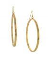 Stir up some drama in eye-catching hoops. BCBGeneration takes style to the next level in large drop hoops crafted in gold tone mixed metal. Approximate diameter: 2-1/2 inches.