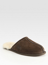 Warm, comfortable suede slip-ons are fully lined in sheepskin with a sheepskin sockliner that naturally wicks away moisture and helps keep feet dry. Lightweight sueded rubber outsole with embossed logo Imported Warm, comfortable suede slip-ons are fully lined in sheepskin with a sheepskin sockliner that naturally wicks away moisture and helps keep feet dry. Lightweight sueded rubber outsole with embossed logo Imported
