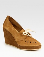 Perforated leather and suede classic with a lace-up front. Self-covered wedge, 4 (100mm)Self-covered platform, 1 (25mm)Compares to a 3 heel (75mm)Leather and suede upperLeather liningRubber solePadded insoleMade in FranceOUR FIT MODEL RECOMMENDS ordering true whole size; ½ sizes should order the next whole size up. 
