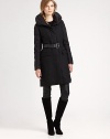 A hint of mixed media gives this cozy, goose-down coat with a feminine shape, unmistakable appeal.Pillow collarQuilted sleevesConcealed front zipperBelted designFlap pocketsAbout 36 from shoulder to hemBody: wool/polyester/viscoseFill: goose-downDry cleanImported Model shown is 5'10 (177cm) wearing US size 4. 