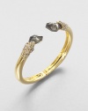 From the Miss Havisham Collection. A simple golden bangle is stunningly capped by faceted doublets of pyrite and white quartz and sprinkled with Swarovski crystals.CrystalWhite quartz and pyriteGoldtoneDiameter, about 2.4Width, about .6HingedMade in USA
