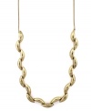 A touch of gold. Oval beads create a luxurious look on Jessica Simpson's trendy long necklace. Set in gold tone mixed metal. Approximate length: 32 inches.