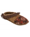 Soft and fun. The Kaya faux-fur slippers by Muk Luks feature colorful patterns on the vamp and fringe detailing all along the heel.