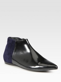Flat leather ankle boot has a side zipper, point toe and contrasting suede back. Leather and suede upperSide zipperPoint toeLeather lining and solePadded insoleMade in Italy Flat leather ankle boot has a side zipper, point toe and contrasting suede back. Leather and suede upperSide zipperPoint toeLeather lining and solePadded insoleMade in Italy