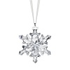 Recalling a delicate natural snowflake in sparkling crystal, this festive holiday ornament from Swarovski features a tiny silvery tag engraved with the year 2012.