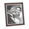 Accent your photographs with a nature-inspired frame from Reed & Barton, inlaid with faux tortoise and banded with tarnish-resistant silver-plate for an attractive display at home or the office.