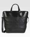 Iconic woven leather tote with adjustable shoulder strap for comfortable cross-body wear.Magnetic snap button closureTop handleAdjustable shoulder strapFully lined12¾W x 14½H x 6½DMade in Italy